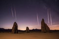 perseid meteors over a desert landscape at night