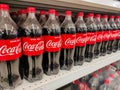 PerSelective focus. Bottle of Coca cola drinking water sold in a supermarket.Shot were noise and artifacts