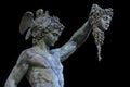 Perseus holding the head of Medusa on black background,Florence