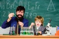 Perseverance pays off. Attention deficit hyperactivity disorder. Teacher child test tubes. School lesson. Chemical Royalty Free Stock Photo