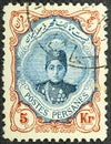 Persia circa 1922. Cancelled postage stamp printed by Persia, that shows Ahmad Shah Qajar in an ornament frame, circa