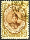 Persia circa 1922. Cancelled postage stamp printed by Persia, that shows Ahmad Shah Qajar in an ornament frame, circa