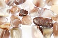 Persian agate heap stones texture on white light background