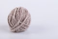 Persian cat raw wool yarn coiled into a ball Royalty Free Stock Photo