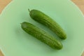 Persian cucumbers on green plate