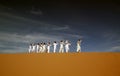 Persian ethnic dancers on sand dune in a festival in Eastern Iran