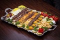 Close up of Persian Mix Kebab consist of minced meat chicken and steak with rice in large tray Royalty Free Stock Photo