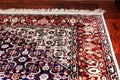 Persian Oriental Rug on wooden floor Royalty Free Stock Photo