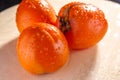 persimmon close-up with water drops Royalty Free Stock Photo