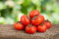Persimmon fruit on wooden table with blurred garden background Royalty Free Stock Photo