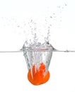 Orange splashing in water