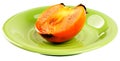 Persimmon on plate Royalty Free Stock Photo