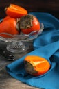 Persimmons in vase Royalty Free Stock Photo
