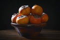 Persimmons in a wooden bowl