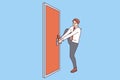 Persistent businessman is trying to open locked door, without giving up and striving to achieve goal