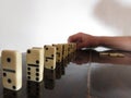 Person accommodating domino game Royalty Free Stock Photo