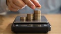 Person Adding Coin Stacks Onto Digital Kitchen Scale For Weighing Royalty Free Stock Photo