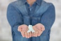 person with aids ribbons in hands