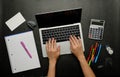 The person analyzing financial data.office and study stationery with a laptop for online work and back to school