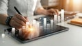 Person analyzing financial data on a tablet with charts and graphs overlay business Royalty Free Stock Photo