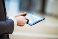 Person analyzing financial statistics displayed on the tablet screen Royalty Free Stock Photo