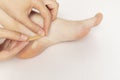 Person Applies Adhesive Plaster On Foot Calluses, Skin Corns on Heel and Phalange of Toe