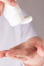 Person applying hand sanitizer gel close up