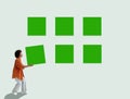 Person arranging green squares symbolizing creative problem solving. Royalty Free Stock Photo