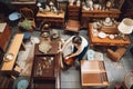 person, arranging and rearranging various items of traditional furniture in room Royalty Free Stock Photo