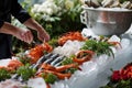 person arranging a seafood ice display Royalty Free Stock Photo