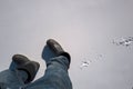 person in black boots walking on freshly fallen snow Royalty Free Stock Photo