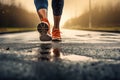 A person braving the rain while jogging on a wet road, taking advantage of the wet weather for an invigorating workout, Runner