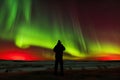 person, capturing the incredible aurora borealis and australis, with silhouette of person visible