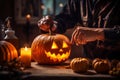 Person crafting a jack-o-lantern in warm candlelight, enhancing the cozy Halloween ambiance.