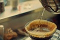 person carefully pouring hot water for a pourover brew Royalty Free Stock Photo