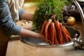 Person, carrots and washing in sink as vegetable nutrition for wellness ingredient for healthy, salad or organic. Hands Royalty Free Stock Photo