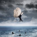 Person carrying a brain above sea Royalty Free Stock Photo