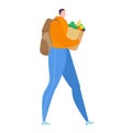 Person carrying groceries in paper bag walking casually. Adult in casual clothes with backpack shopping for fresh