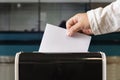 person casts her ballot during voting for parliamentary elections at a polling station Royalty Free Stock Photo