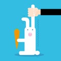 Person catching rabbit with carrot