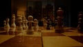 Person chessman hand moves white pawn piece on chessboard