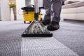 Person Cleaning Carpet With Vacuum Cleaner Royalty Free Stock Photo