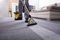 Person Cleaning Carpet With Vacuum Cleaner Royalty Free Stock Photo