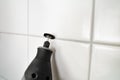 Person Cleaning The White Tile Using Power Tool Royalty Free Stock Photo