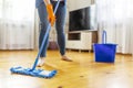 Person Cleaning Floor with Mop and Bucket Royalty Free Stock Photo