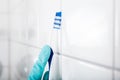 Person Cleaning The White Tile Using Brush Royalty Free Stock Photo