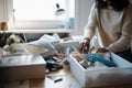 person, clearing clutter from desk, getting ready for a fresh start