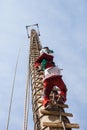 Person climbing a pole for Danza de los Voladores in Cuetzalan del Progreso, Puebla, Mexico