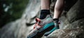 Person climbing while wearing rock climbing shoes. Generative AI Royalty Free Stock Photo