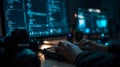Person coding on computer with multiple screens showing lines of code in a dark room setting at night Royalty Free Stock Photo
